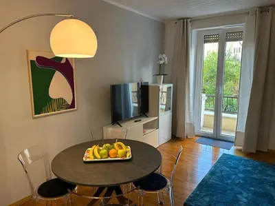 a living room with a table with a bowl of fruit at Trastevere Monteverde Velia House in Rome