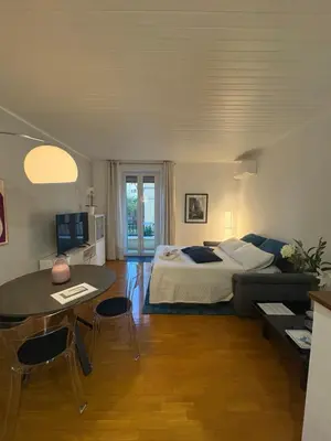 a bedroom with a bed and a table with chairs at Trastevere Monteverde Velia House in Rome