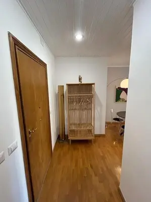 an empty room with a door and a wooden floor at Trastevere Monteverde Velia House in Rome