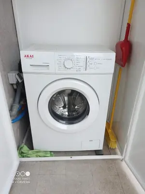 a washing machine in a corner of a room at Domus Gianicolense in Rome
