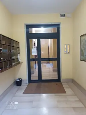 a door that is in a room with aoine at Domus Gianicolense in Rome