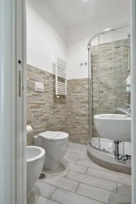 a bathroom with a toilet and a sink at Vatican's Roof in Rome