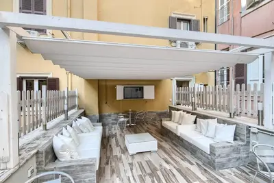 a balcony with couches and a tv on a building at Vatican's Roof in Rome