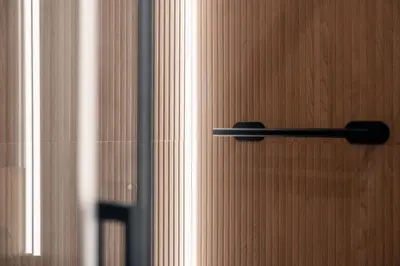 a black door handle on a wooden door at Victorian House, Rome Center in Rome
