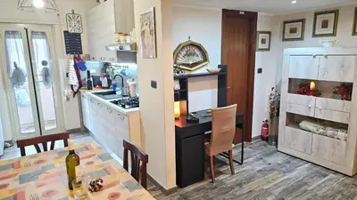 a kitchen with a table and a dining room at Corona House in Rome
