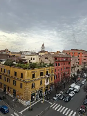 an aerial view of a city with cars and buildings at San Lorenzo House in Rome