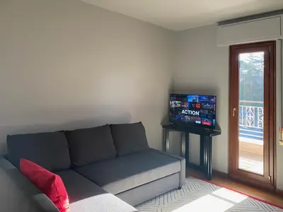 a living room with a couch and a television at The Attic Apartment in Rome
