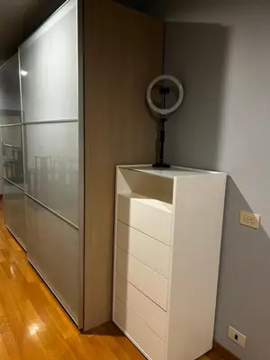 a white refrigerator with a mirror on top of it at The Attic Apartment in Rome
