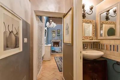 a bathroom with a sink and a mirror at Rome as you feel - Vicolo delle Grotte in Rome
