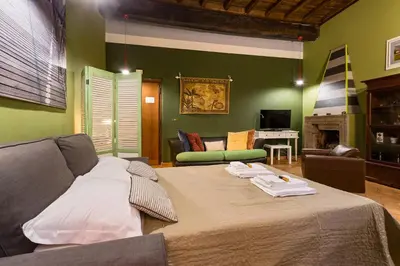 a bedroom with a bed with two towels on it at Rome as you feel - Vicolo delle Grotte in Rome