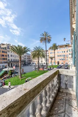 a view from a balcony of a city with palm trees at Residenza Pierret in Rome