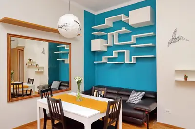 a dining room with a table and a mirror at Monteverde family apartment in Rome
