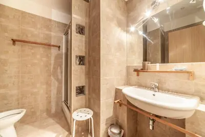 a bathroom with a sink and a toilet at Ubaldi Luxury Rooms in Rome