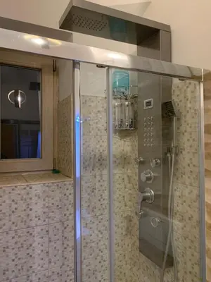a shower with a glass enclosure in a bathroom at Domus Felix Rome in Rome
