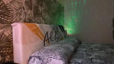 a bedroom with a bed with graffiti on the wall at Domus Felix Rome in Rome