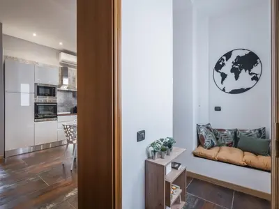 a living room with a couch and a table at The Best Rent - Three-bedroom apartment near Piazza Barberini in Rome