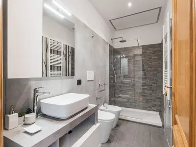 a bathroom with a sink and a toilet and a shower at The Best Rent - Three-bedroom apartment near Piazza Barberini in Rome