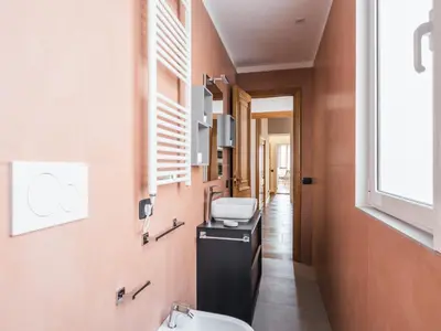 a bathroom with a sink and a toilet at The Best Rent - Three-bedroom apartment near Piazza Barberini in Rome