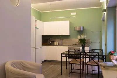 a kitchen and dining room with a table and chairs at Domus Rinascimento (Piazza Navona) in Rome