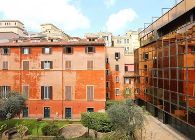 an apartment building in a city with buildings at Saturno in Trevi in Rome