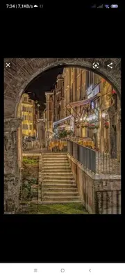 a view of a city with stairs under a bridge at Marcello Apartament in Rome