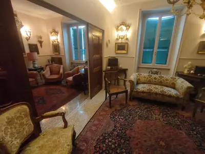 a living room with couches and chairs and windows at Gay House Roma - Only Gay in Rome