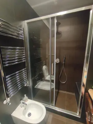a bathroom with a shower with a sink and a toilet at Gay House Roma - Only Gay in Rome