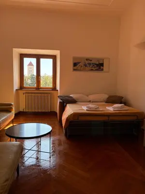 a room with a bed and a coffee table at AppleMoon2.0 in Rome