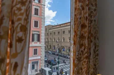 a view of a city street from a window at Cola Suites Apartments in Rome