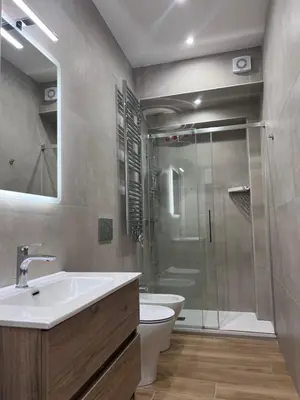 a bathroom with a shower and a sink and a toilet at Palestro 78 in Rome