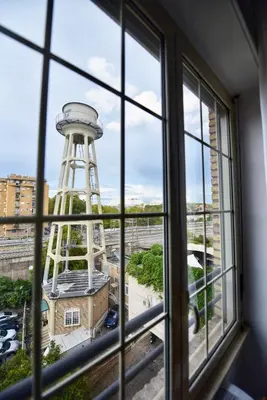 a view of a water tower from a window at Industrial Loft Trastevere Station in Rome