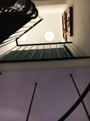 a staircase in the ceiling of a room at Grottino 3a Apartment in Rome