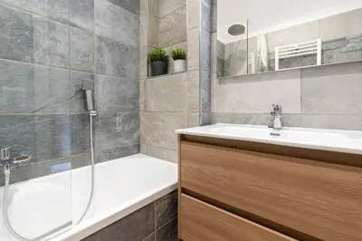 a bathroom with a tub and a sink and a shower at PL Guest House in Rome