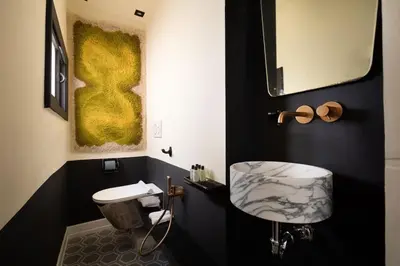 a black and white bathroom with a sink and a toilet at Via Veneto Supreme Terrace in Rome