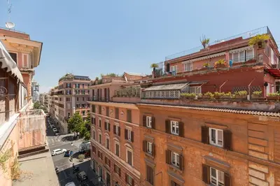 an overhead view of a city street with buildings at Via Veneto Supreme Terrace in Rome