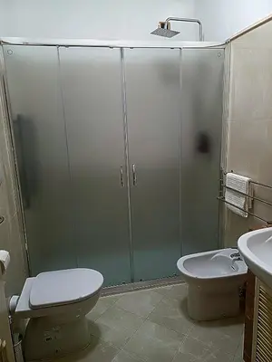a bathroom with a shower with a toilet and a sink at La Casetta di Miriam a Piazza di Spagna in Rome
