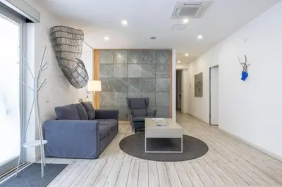 a living room with a couch and a table at Vatican Momahouse Luxury by Varental in Rome