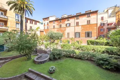 a courtyard in a building with a garden at Venere in Trevi in Rome