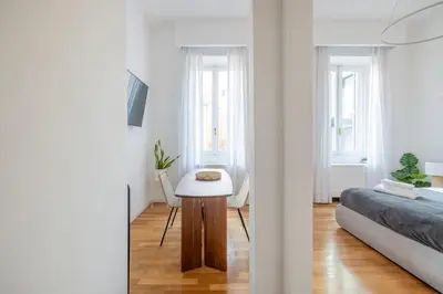 a bedroom with a bed and a table in a room at Venere in Trevi in Rome