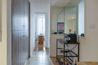 a room with a hallway with a counter and a mirror at Venere in Trevi in Rome