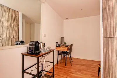 a kitchen with a table and a desk in a room at Venere in Trevi in Rome