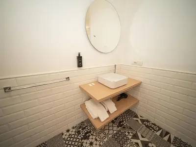 a bathroom with a sink and a mirror at Youroom Margutta in Rome