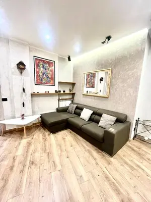 a living room with a couch and a table at 15 Min. Colosseo 2 - Casa di Micca in Rome