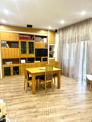 a dining room with a wooden table and chairs at 15 Min. Colosseo 2 - Casa di Micca in Rome