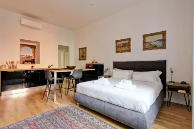 a bedroom with a bed and a table with chairs at Giove in Trevi in Rome