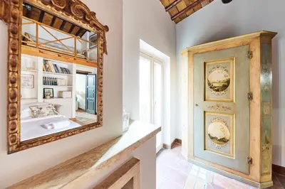 a bathroom with a mirror and a sink at iFlat Shabby Chic Apartament in Rome
