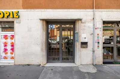 a store front with a door and windows at Comfortable apartment Via Appia - B in Rome