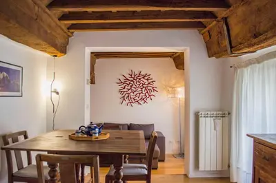 a dining room with a wooden table and chairs at Campo De Fiori- Deluxe&Relax in Rome