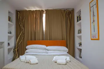 a bedroom with a bed with two towels on it at Campo De Fiori- Deluxe&Relax in Rome