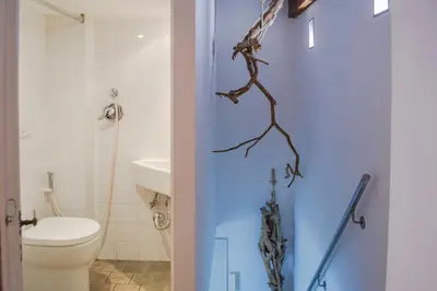 a bathroom with a blue door and a toilet at Campo De Fiori- Deluxe&Relax in Rome